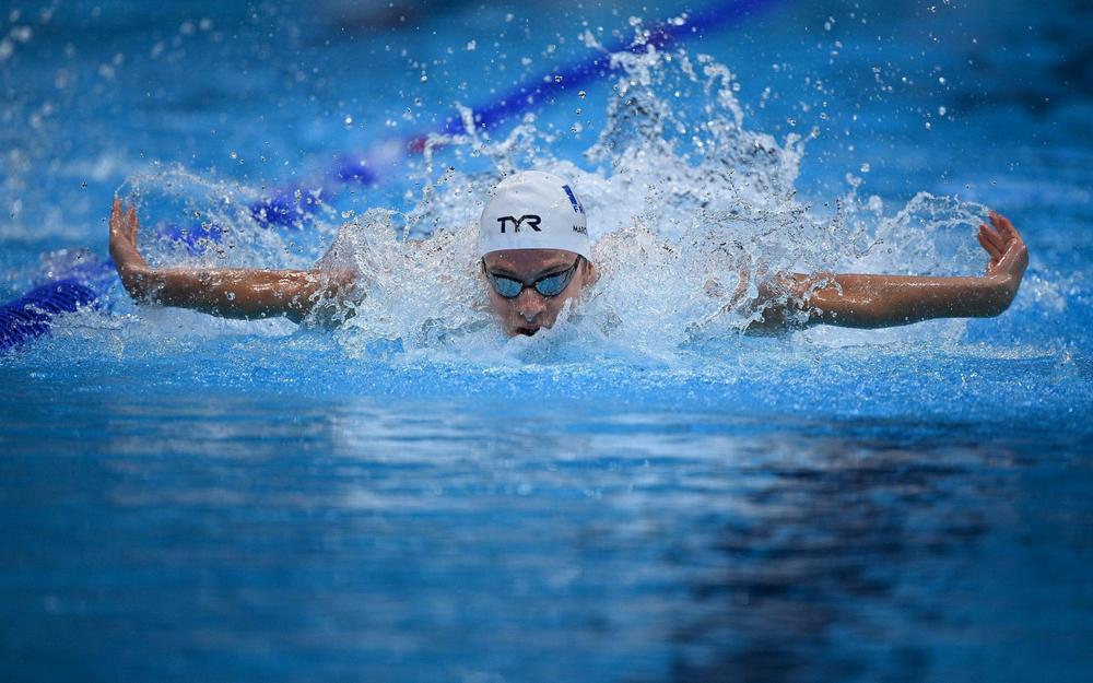 France's Leon Marchand competes in a heat for the men's 4x100m medley